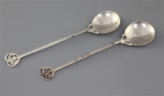 A pair of George V Arts & Crafts silver spoons, by the Keswick School of Industrial Art, 19.3cm.